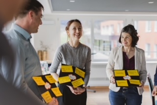 Three participants in an Insights Discovery workshop